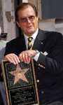  Roger Moore receiving star on Hollywood Walk of Fame, Los Angeles, on Oct 11