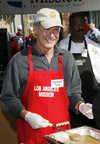 Harrison Ford serving Thanksgiving meals to the homeless, Los Angeles, on Nov 21