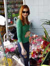 Marcia Cross looking at flowers, in Santa Monica.