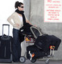 Sandra Bullock and her dog in a dog carrier arriving at Austin Bergstrom International airport, Texas