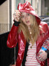 Fearne Cotton wearing a red coat in the rain at the Radio 1 studios, London