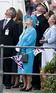 Queen Elizabeth II looking up towards the sky whilst visiting Cumbria
