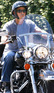 George Clooney riding a Harley Davinson with friends in Portofino, Italy