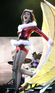 Katy Perry emerges from a giant banana as sexy Santa at the KIIS FM Jingle Ball 
