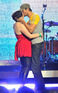 Enrique Iglesias gives fan Jamie Lee Quinn a kiss on stage