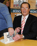 Roger Moore at a book signing for 'My Word is My Bond'