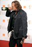 Mickey Rourke celebrates his Best Actor win at the BAFTAs
