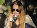 Lohan posts topless photo online