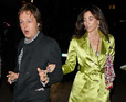 Sir Paul McCartney is pulled away from the limelight by girlfriend Nancy Shevell at the premiere of 'The Boat That Rocked' in Leicester Square.