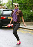 Elle Macpherson makes her way home after taking her child to school, London