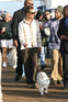 Matthew McConaughey walking his dog at the Surfrider Art and Music Festival on Malibu Pier, California