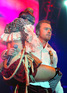 Ronan Keating grapples a dancer during Boyzone's reunion concert in Belfast