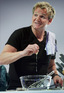 Gordon Ramsay cracks an egg at the Good Food & Wine show in Melbourne, Australia