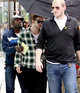 Robert Pattinson hides under an umbrella as he arrives on set for his new Manhattan-based movie, 'Remember Me', accompanied by two bodyguards