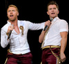 Ronan Keating and Stephen Gatley perform with Boyzone at a concert in Liverpool