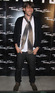 Blur bassist and cheesemaker, Alex James, smiles for cameras at a fashion launch at Somerset house.
