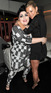 Beth Ditto and Kate Moss embrace at the launch of Beth Ditto's plus-size clothing line in London.