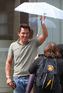 'Torchwood' star John Barrowman takes cover from the rain outside Radio 1 in London.