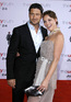 Gerard Butler and Katherine Heigl pose for cameras at the premiere of 'The Ugly Truth' in Los Angeles.