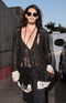 Russell Brand stopping by a Mexican restaurant, wearing his trademark trousers and cardigan, in Malibu, Los Angeles