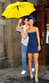 In New York, Rihanna takes cover from the rain under her umbrella, ella, ella...