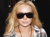 Lindsay Lohan wears slouchy boots to hide her scram ankle bracelet  as she shops in Beverly Hills