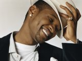 Usher transforms into "super dad"